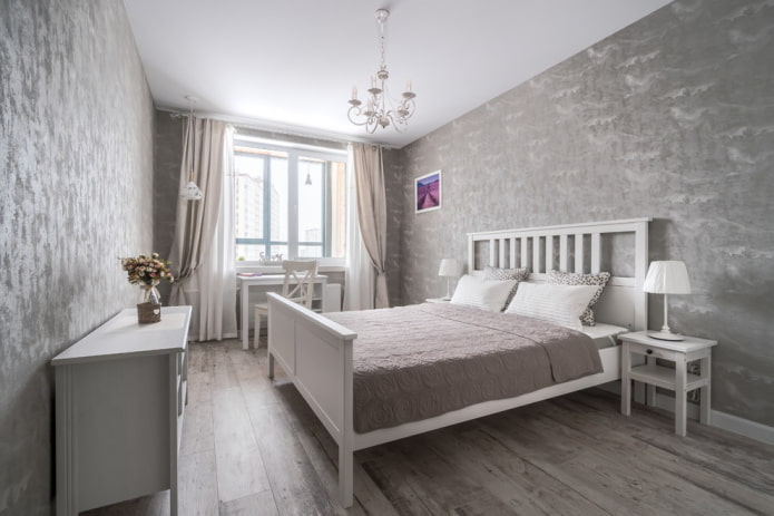 Grau-weißes Schlafzimmerinterieur